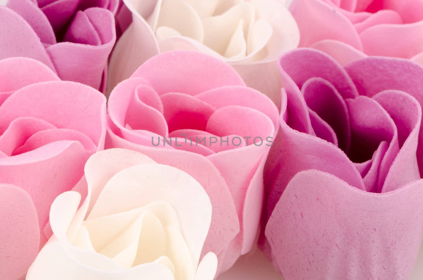 Pink, purple and white beautiful luxury soap roses background.