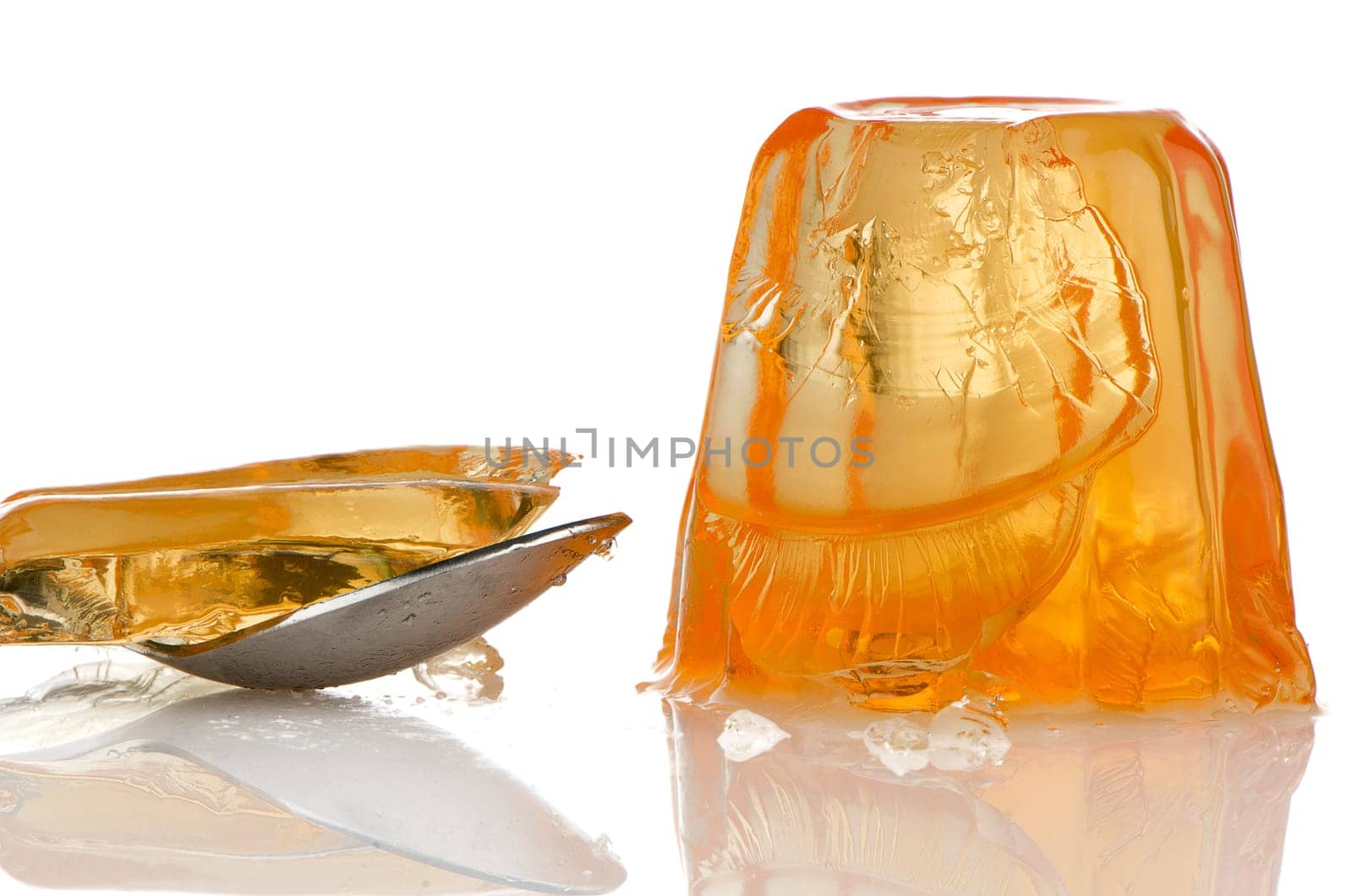 Delicious orange gelatin on a white background.