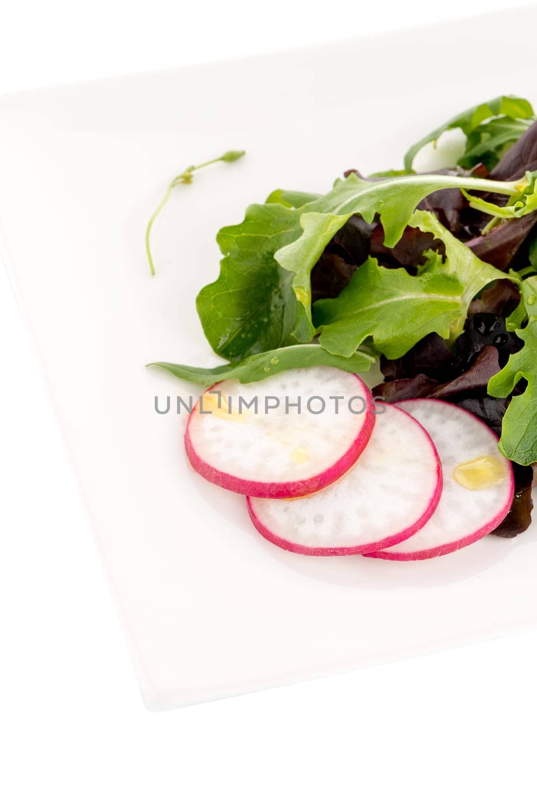 Tasty Greek salad isolated on white background.