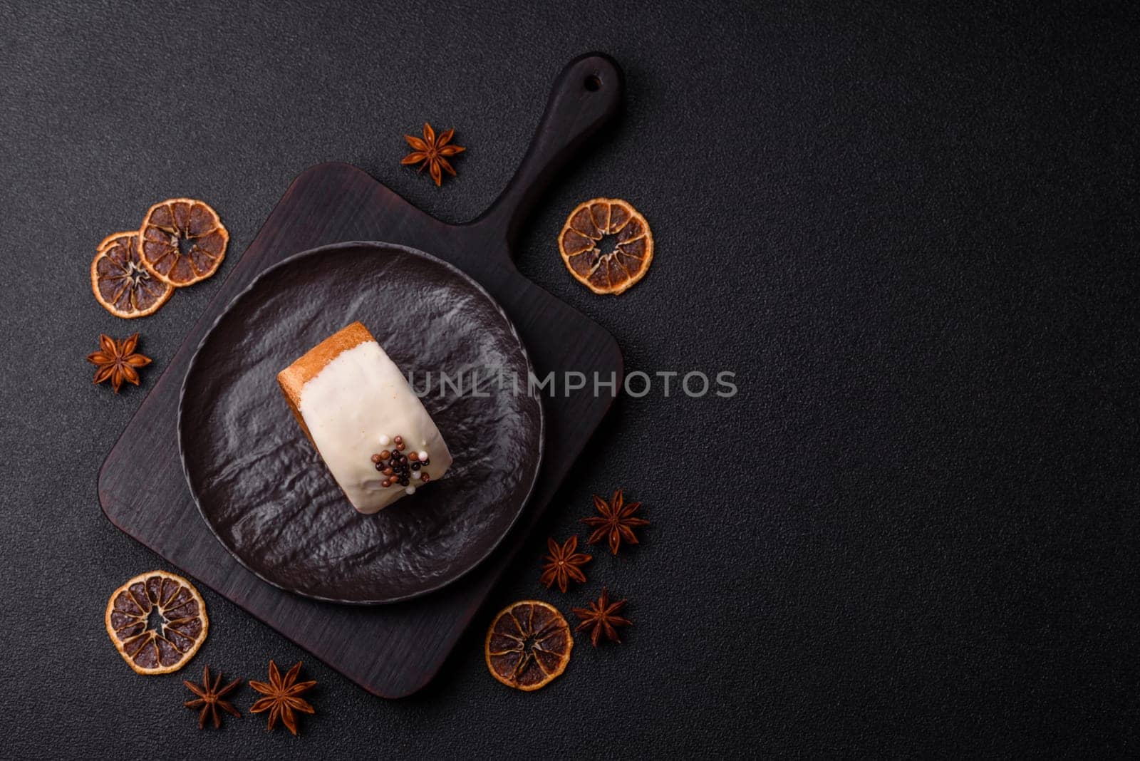 Round sweet New York roll croissant with pistachio cream filling on a dark concrete background