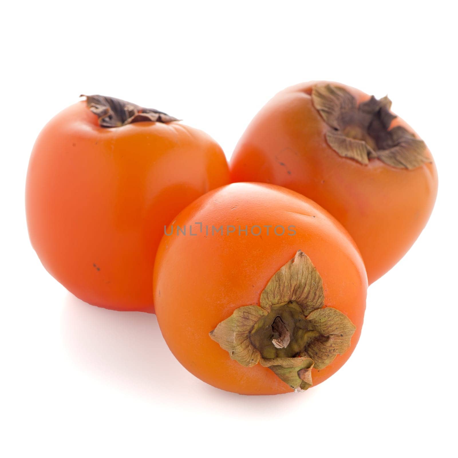 Persimmon fruits on white background.