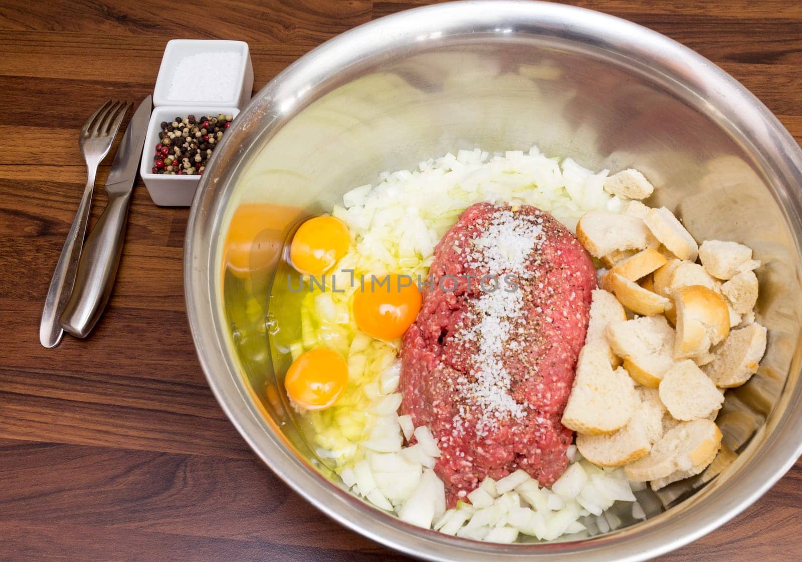 Minced meat in a silver bowl - run to the bulettes! Eggs,onions and spices are also included.