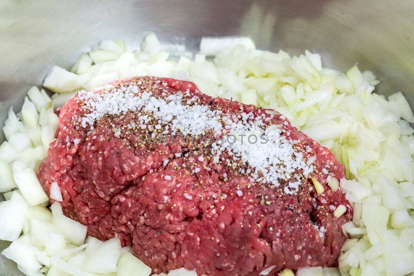 Minced meat in a silver bowl - run to the bulettes! Eggs,onions and spices are also included.