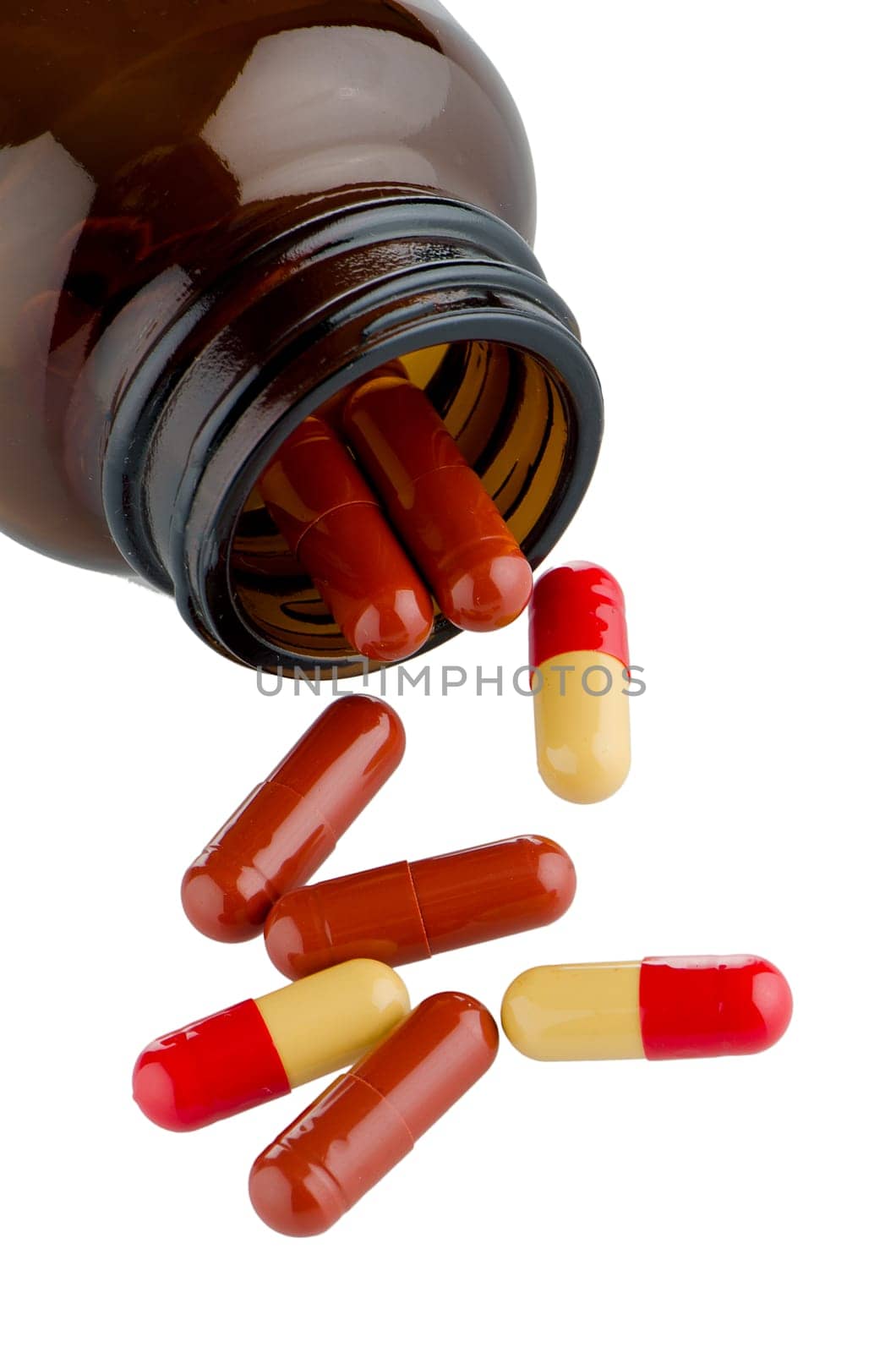 Pills from bottle on the white background.