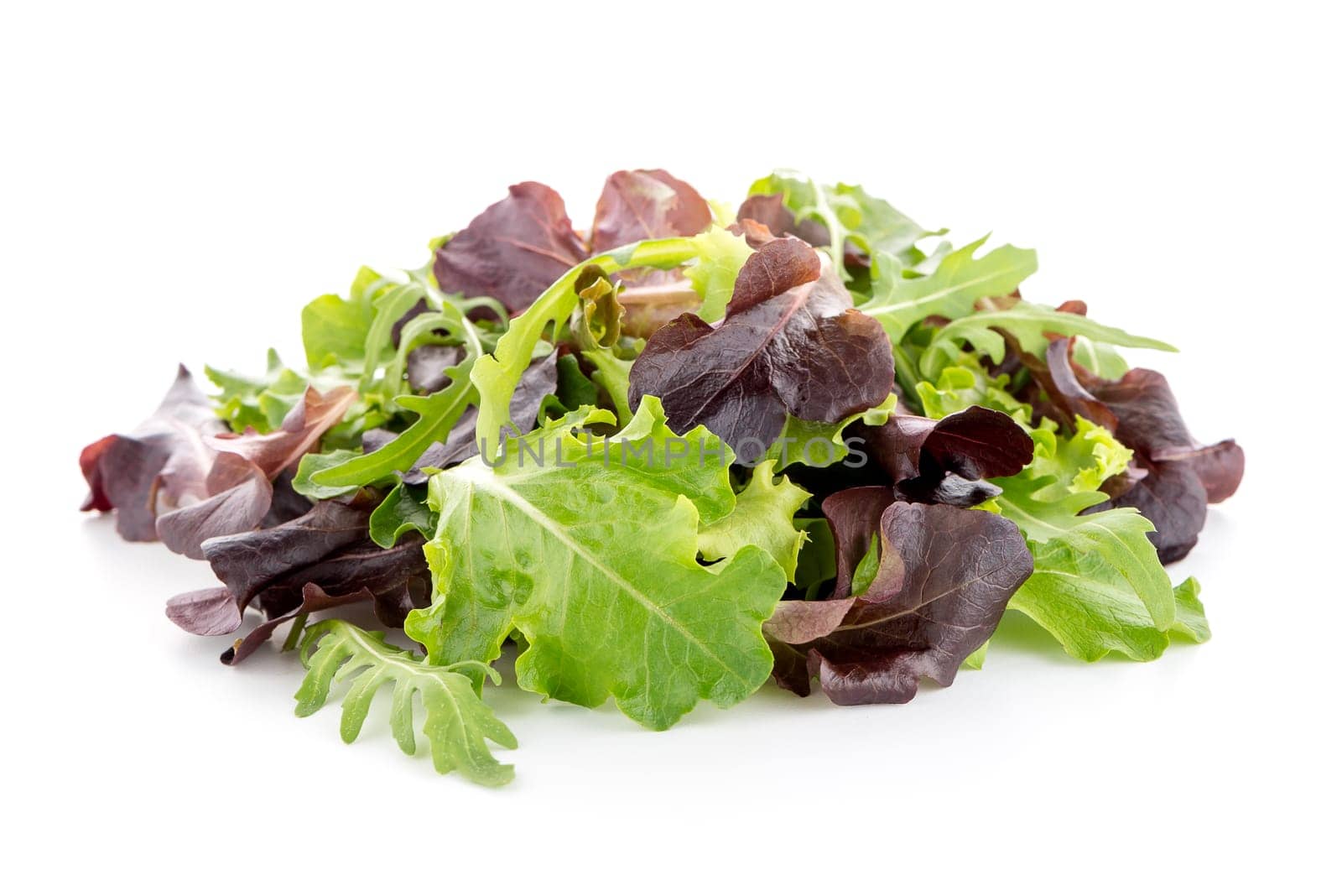 Salad mix with rucola, frisee, radicchio and lamb's lettuce. Isolated on white background.