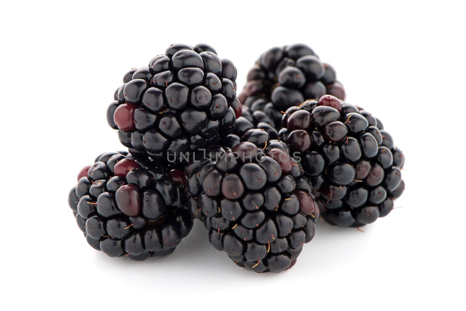 Blackberries with leaves isolated on white background.