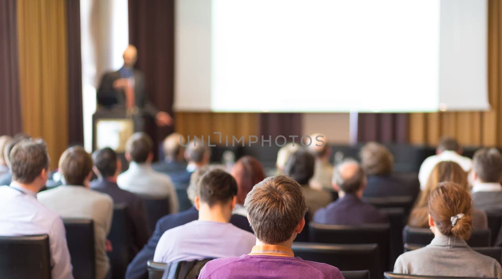 Speaker Giving a Talk at Business Meeting. Audience in the conference hall. Business and Entrepreneurship.