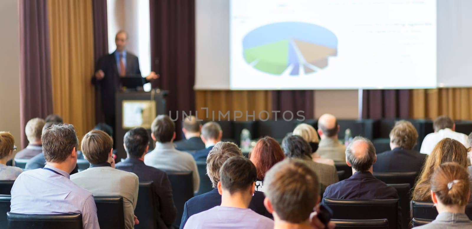 Speaker Giving a Talk at Business Meeting. Audience in the conference hall. Business and Entrepreneurship.