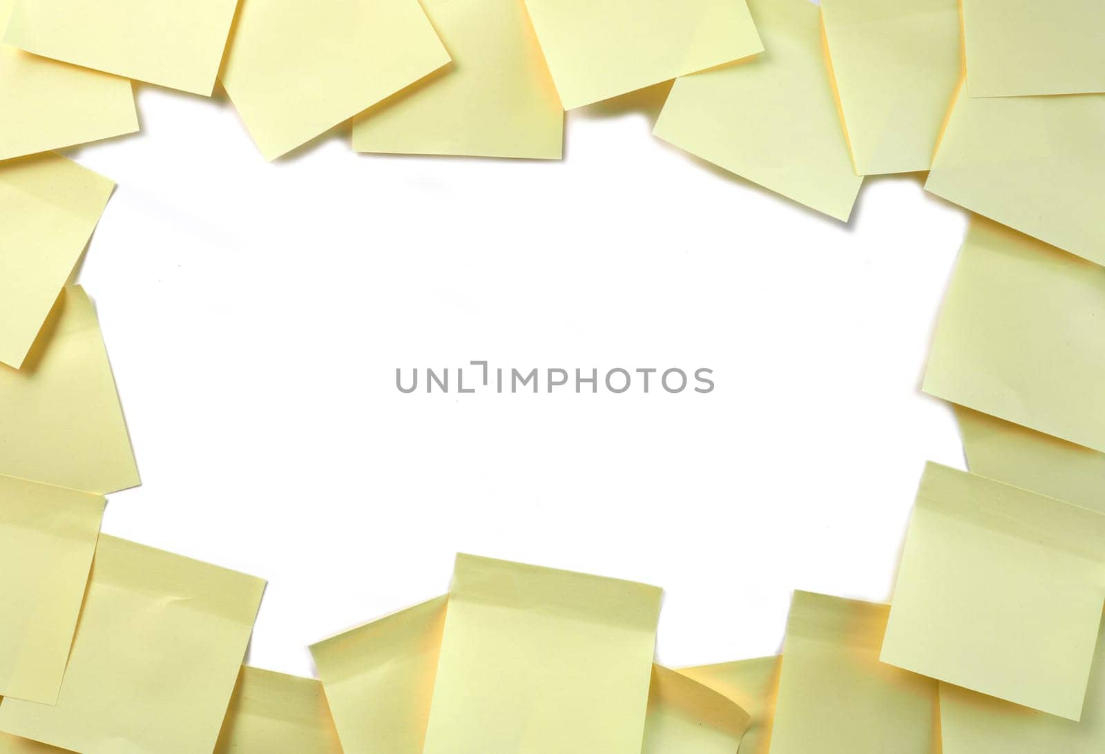 Frame of yellow sticky notes on a white background