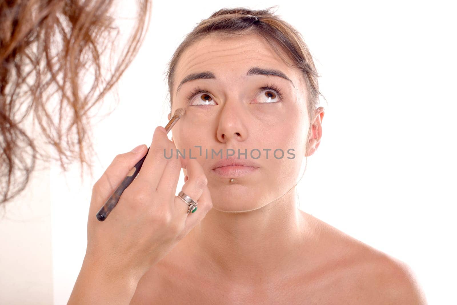 pretty young woman wears make on white background