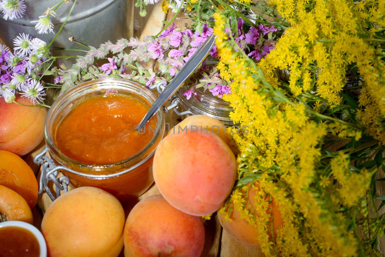 apricot jam with fruit and yellow flowers