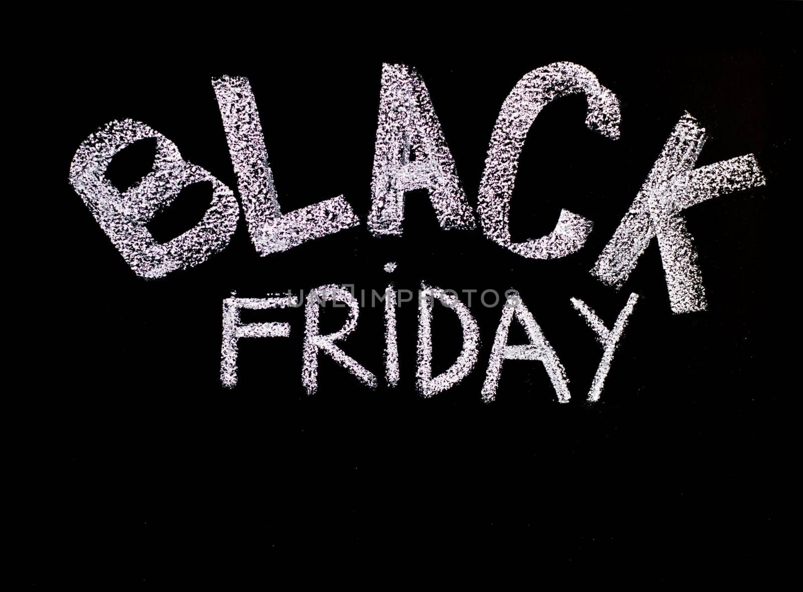 Black Friday advertisement handwritten with chalk on blackboard, Black Friday sale concept
