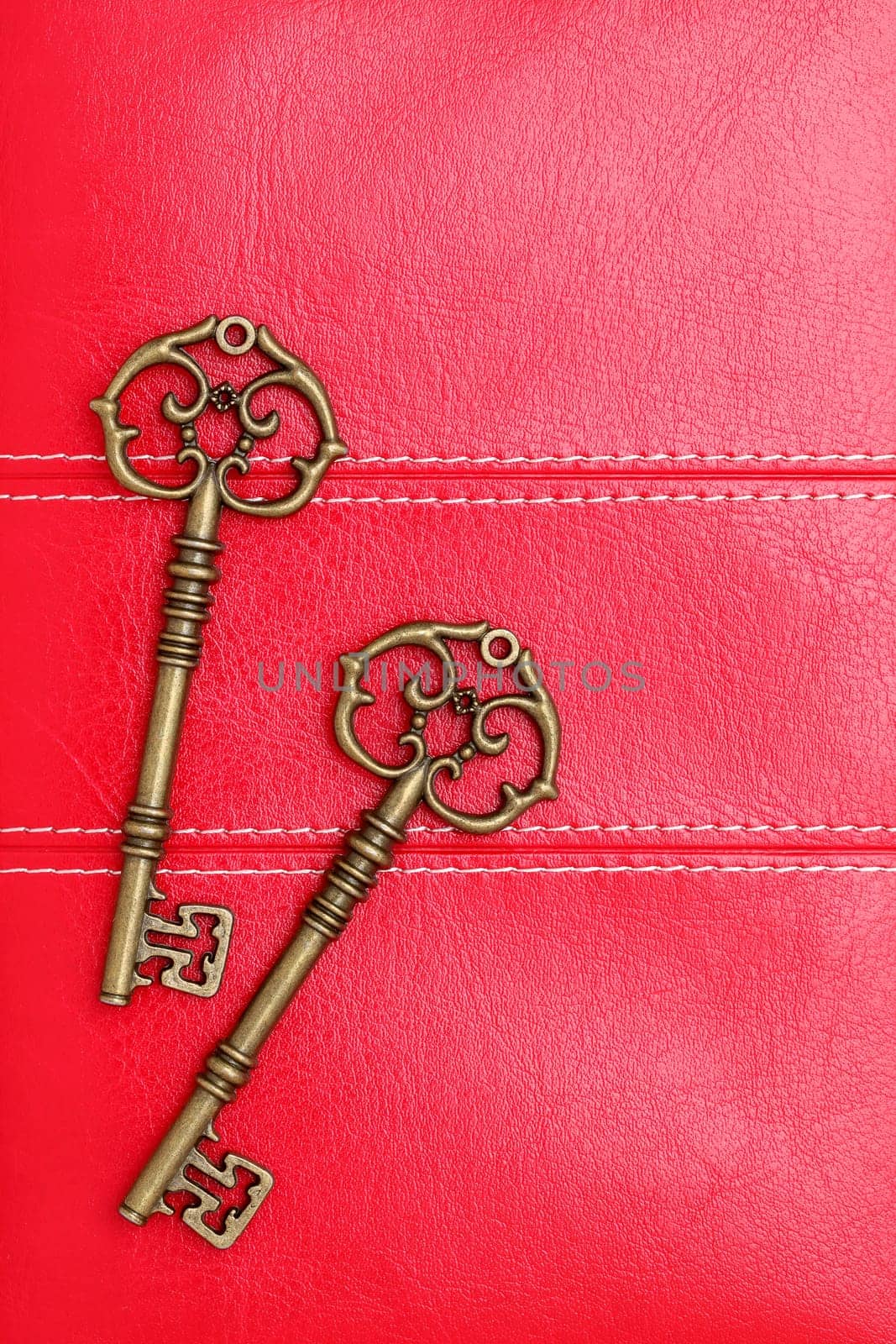 Vintage door key on a leather background