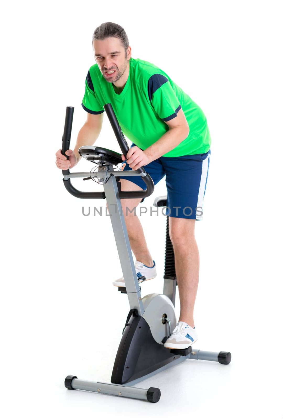young man in green shirt train with fitness machine