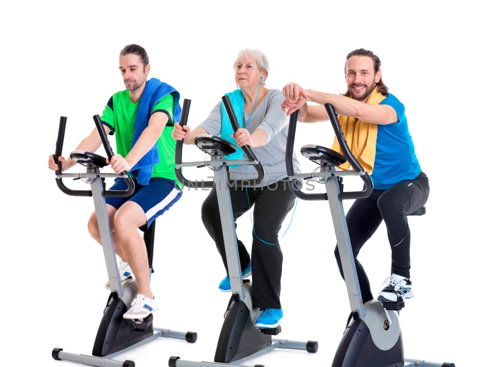 female senior and two young men in fitness center