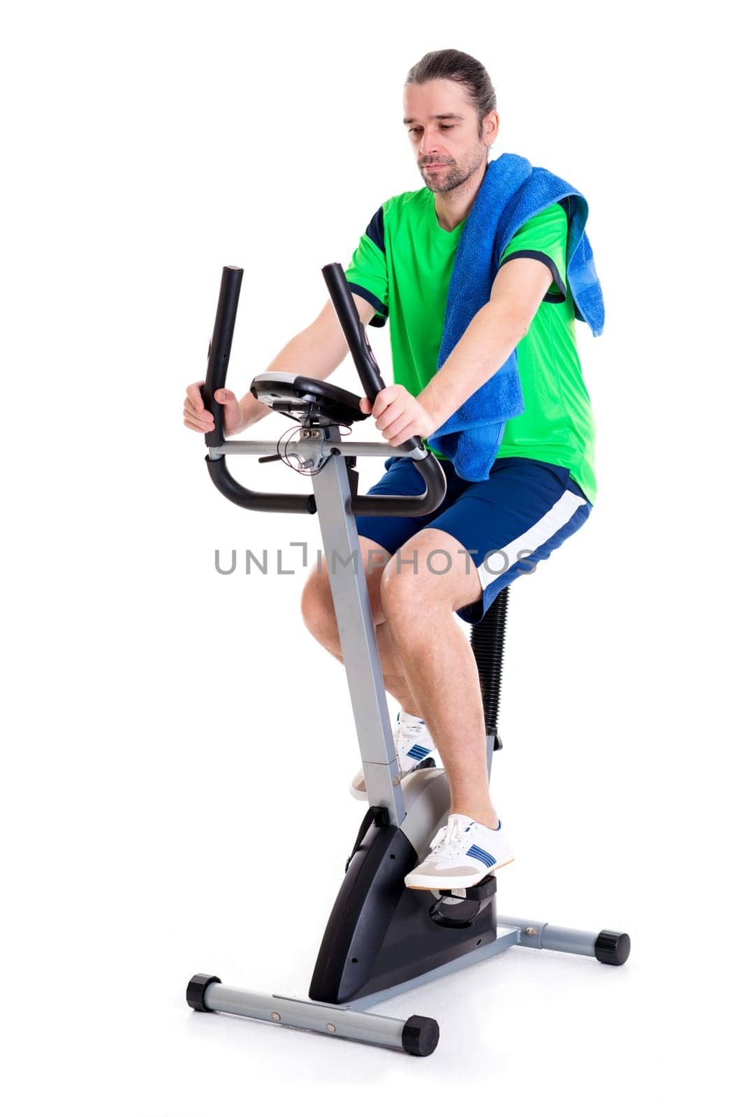 young man in green shirt train with fitness machine