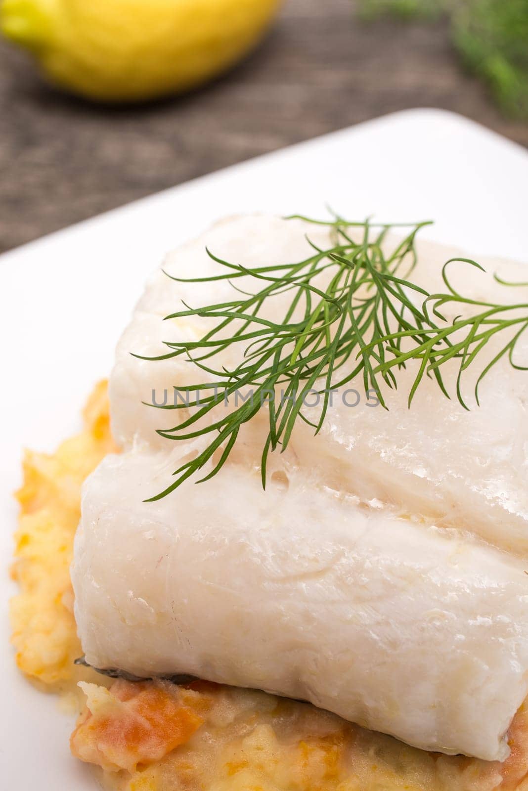 Dill on Skrei cod fish with puree of potatoes and carrots