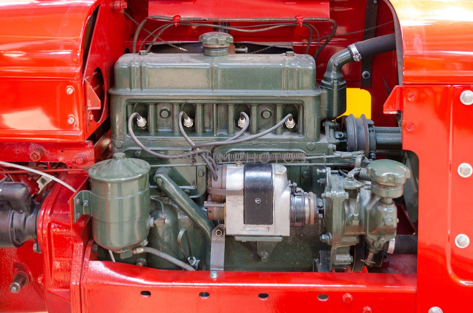 a green diesel engine i a red tractor very powerfull