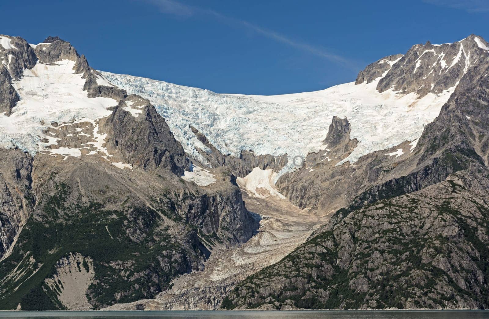 Ogive Glacier Heading to the Ocean in Northwestern Fjord in Kenai Fjords National Park in Alaska
