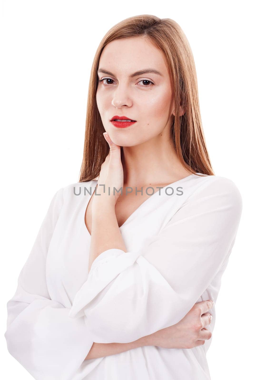 Serious young woman posing relaxed on white background