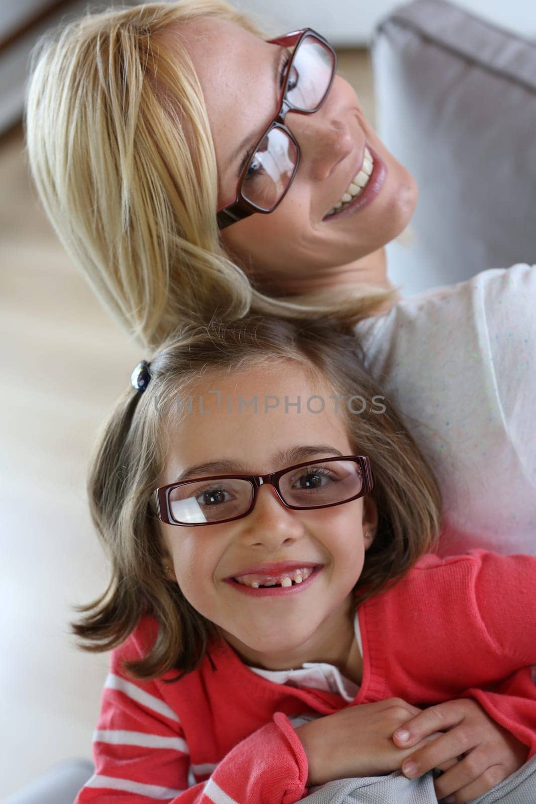 Mother and daughter with eyeglasses on