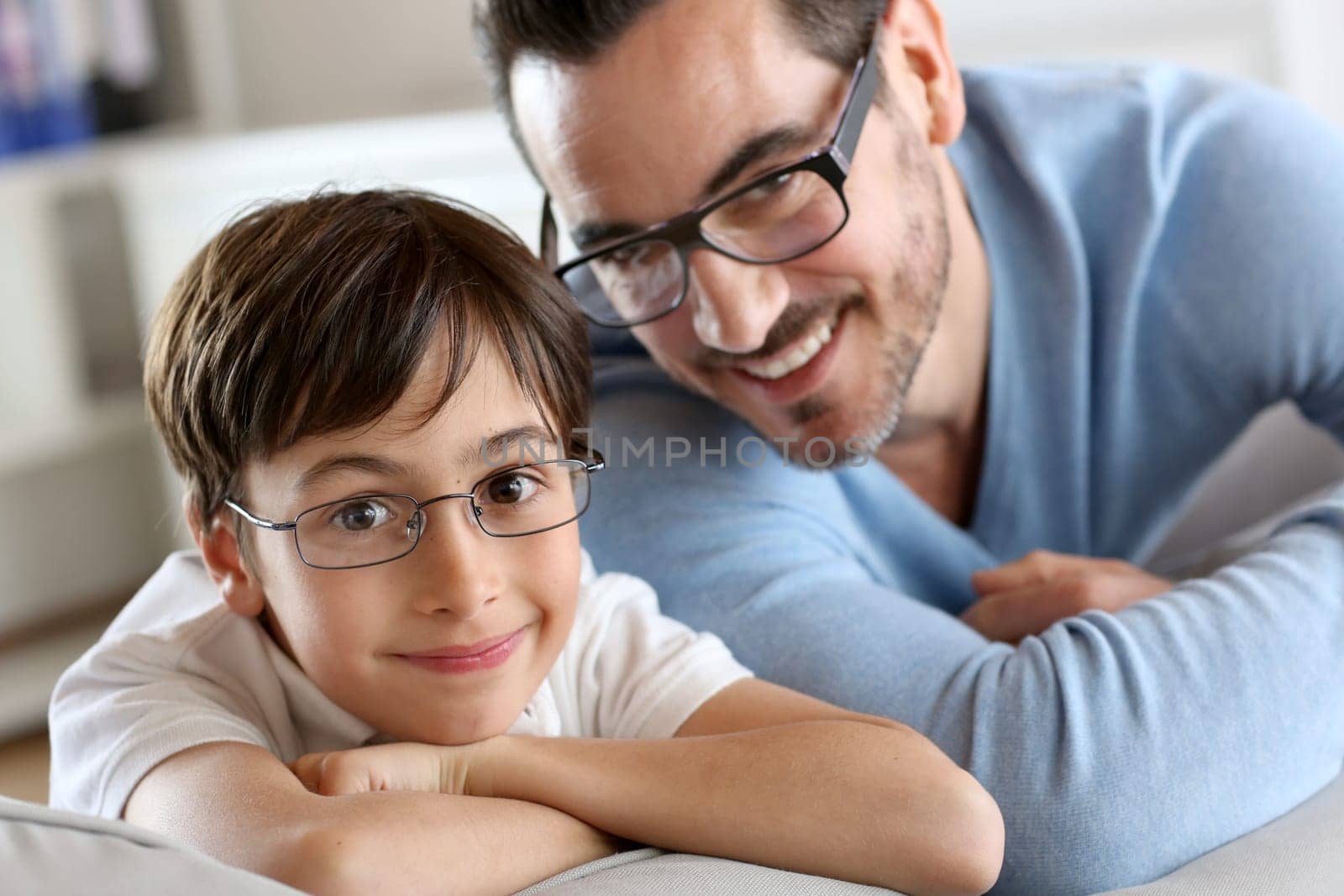Portrait of young boy with daddy with eyeglasses on