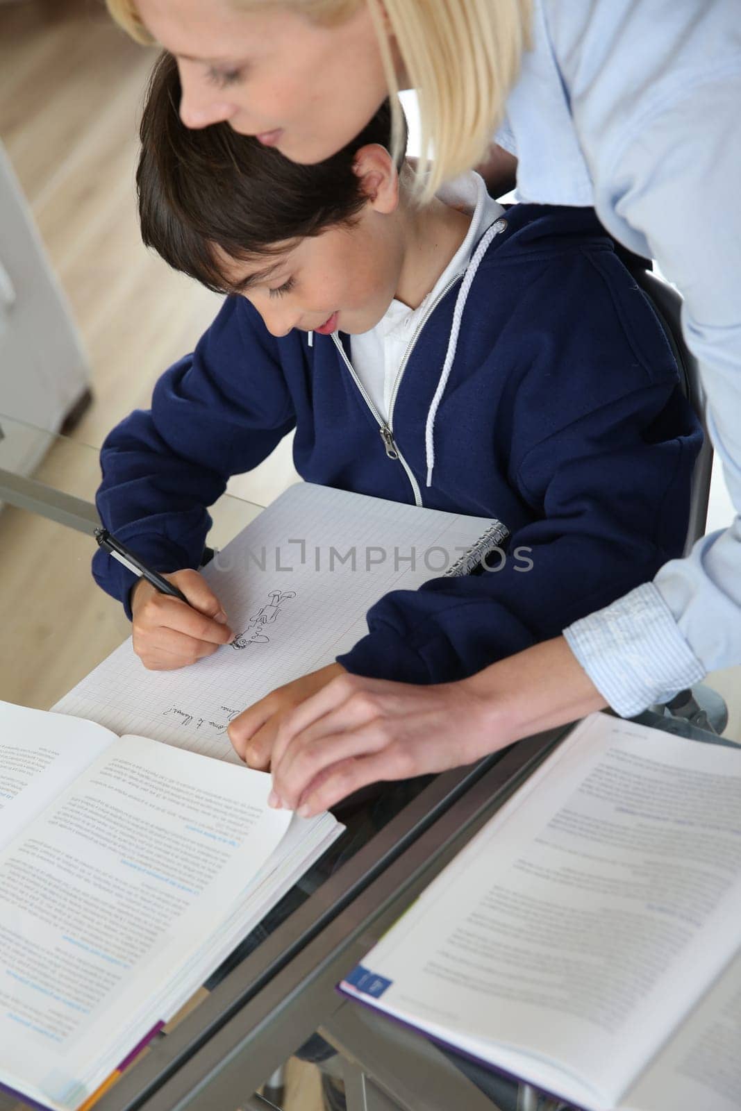 Teacher with kid in classroom