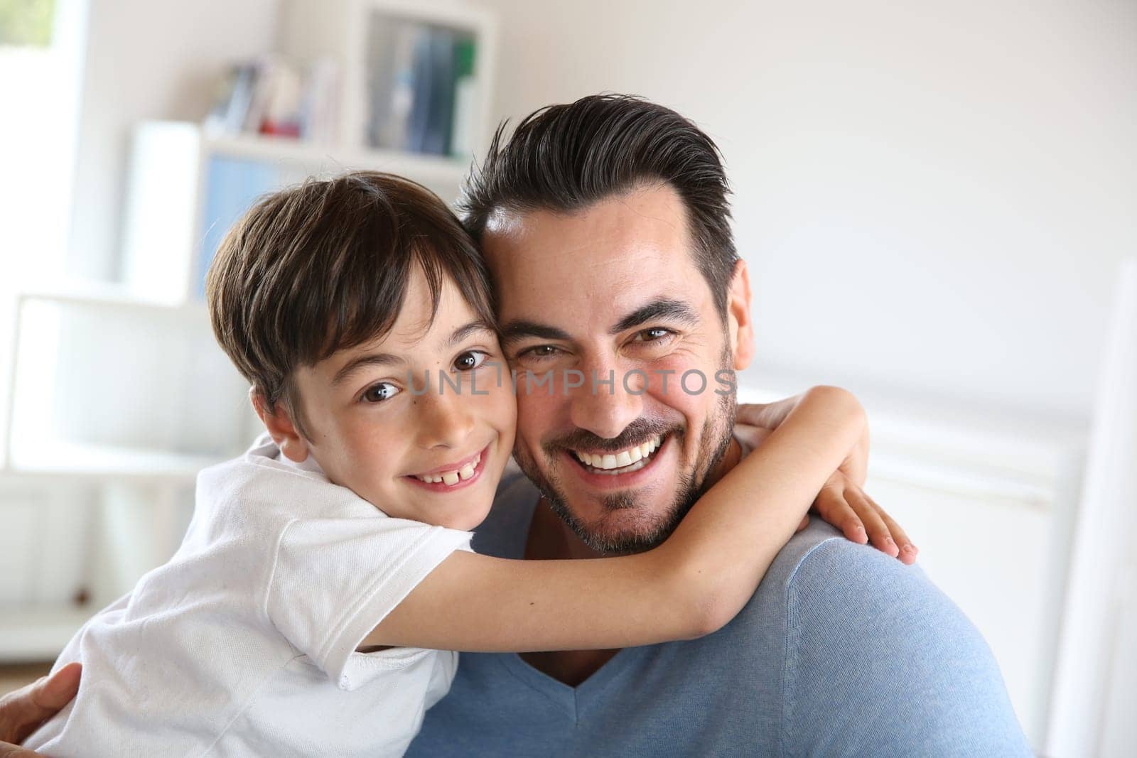 Portrait of father and son relaxing at home