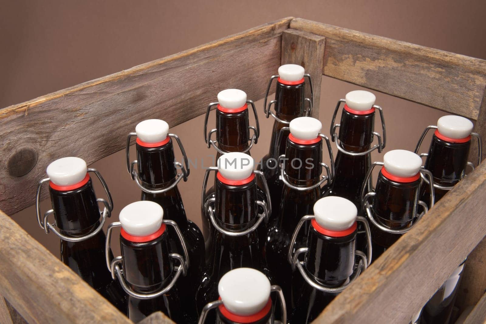 Close-up of many beer bottles with ironing closure in old beer box