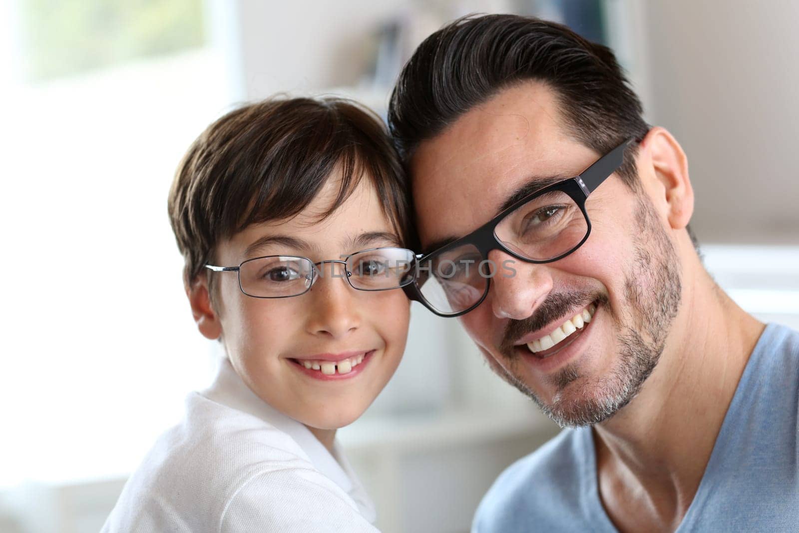 Portrait of young boy with daddy with eyeglasses on