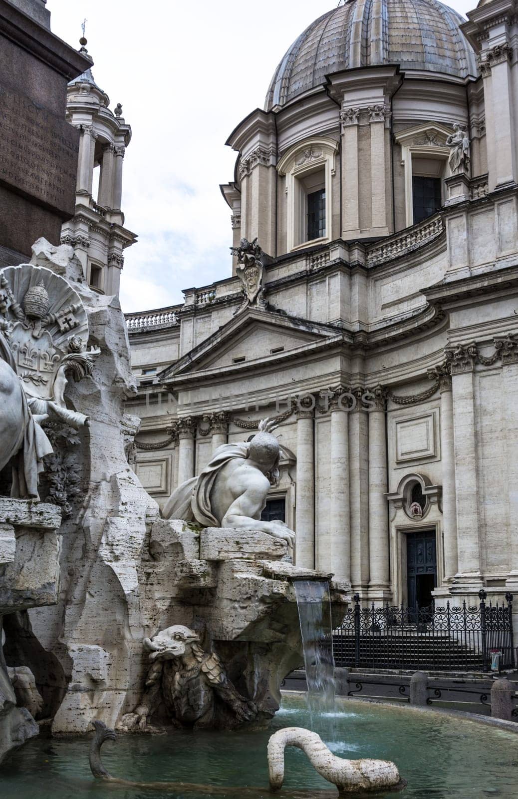 The legend is that Bernini positioned the cowering Rio de la Plata River as if the sculpture was fearing the facade of the church of Sant'Agnese by his rival Borromini could crumble against him  in fact, the fountain was completed several years before Borromini began work on the church.