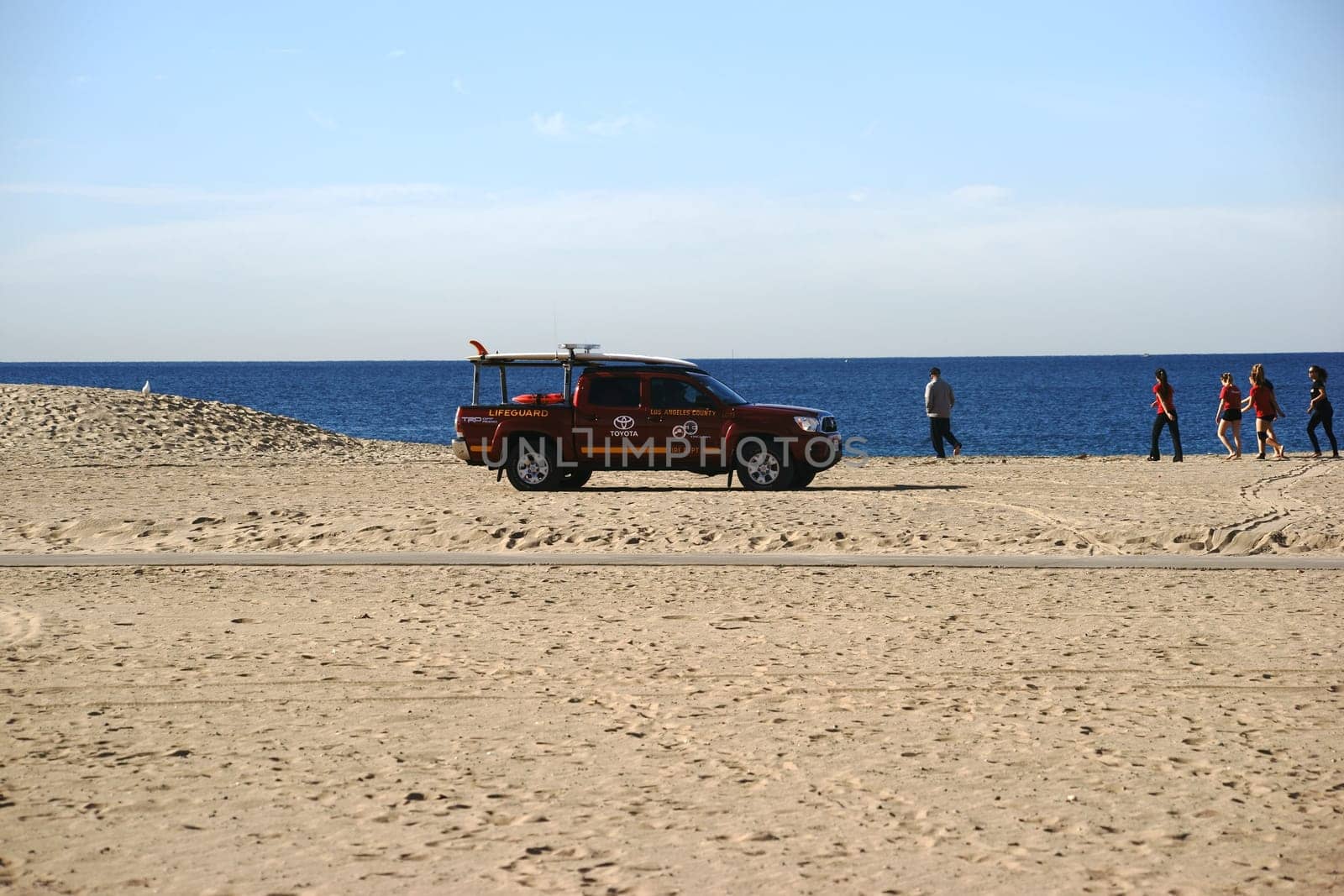 Long Beach,United States - December 26,2015: An ambulance with lifeguards patrols along the beach of Long Beach,where athletes train on December 26,2015 in Long Beach.