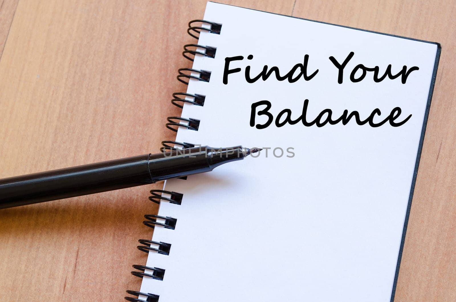 Find your balance text concept write on notebook with pen