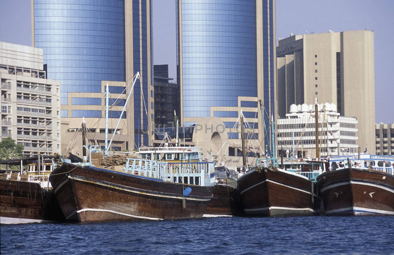 Import and export goods at the harbour at the Dubai creek in the old town in the city of Dubai in the Arab Emirates in the Gulf of Arabia.