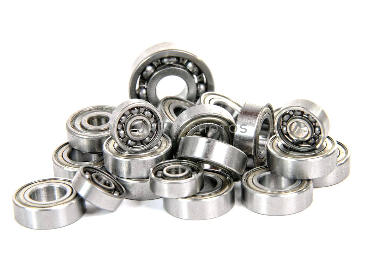 lot of small ball bearings on the white background