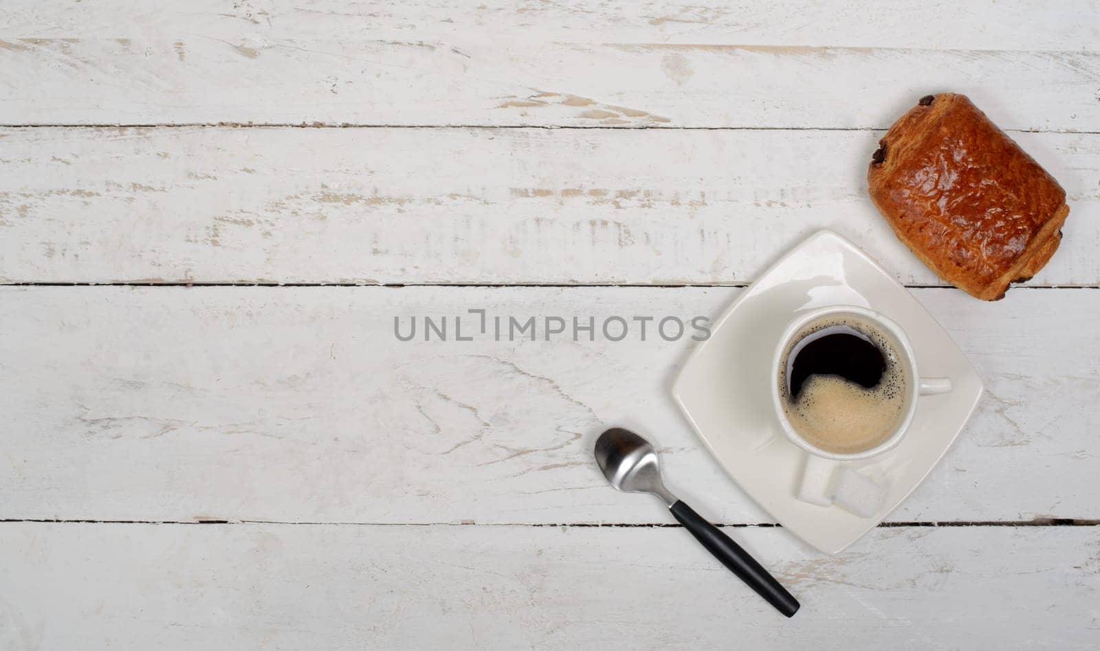 French breakfast with coffee and pastries on white table