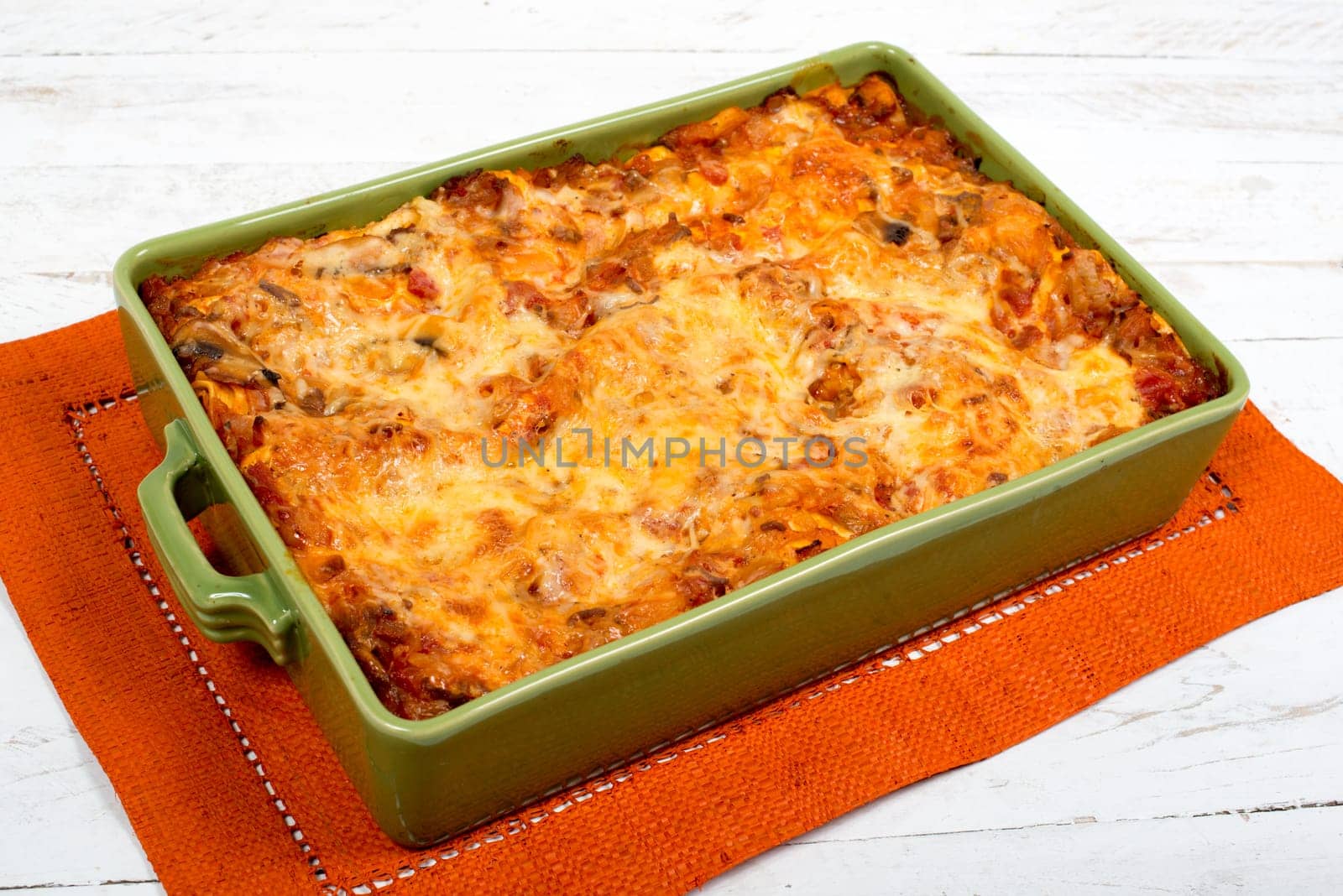lasagna dish on orange towel