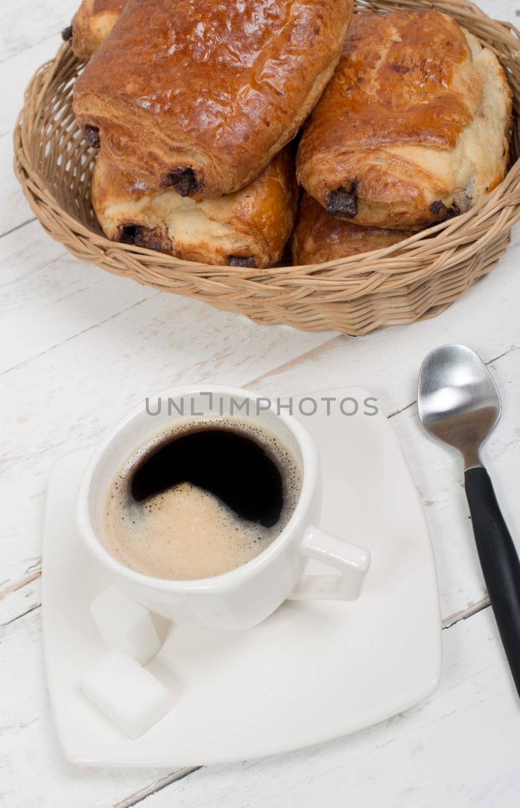 French breakfast with coffee and pastries on white table