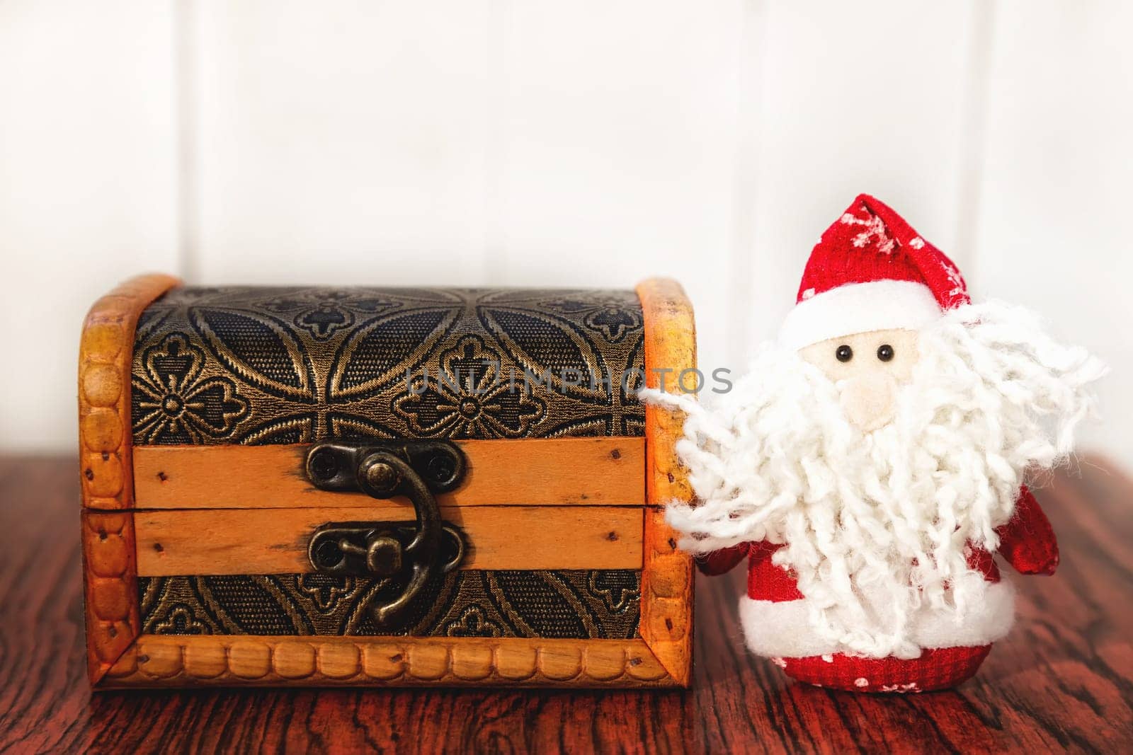 Christmas Santa Claus or Father Frost and wooden chest on wooden background