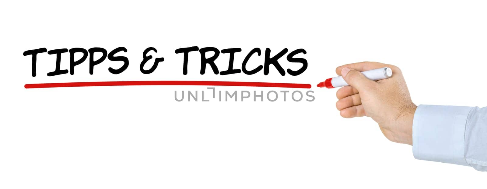 Hand with pen writes tips and tricks