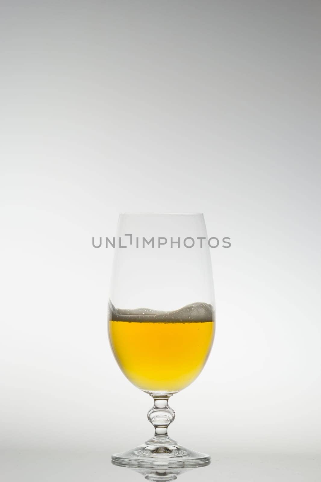 Beer in a glass with very little foam