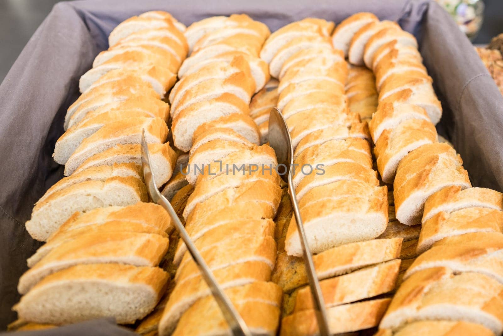 Slices of white bread with pliers