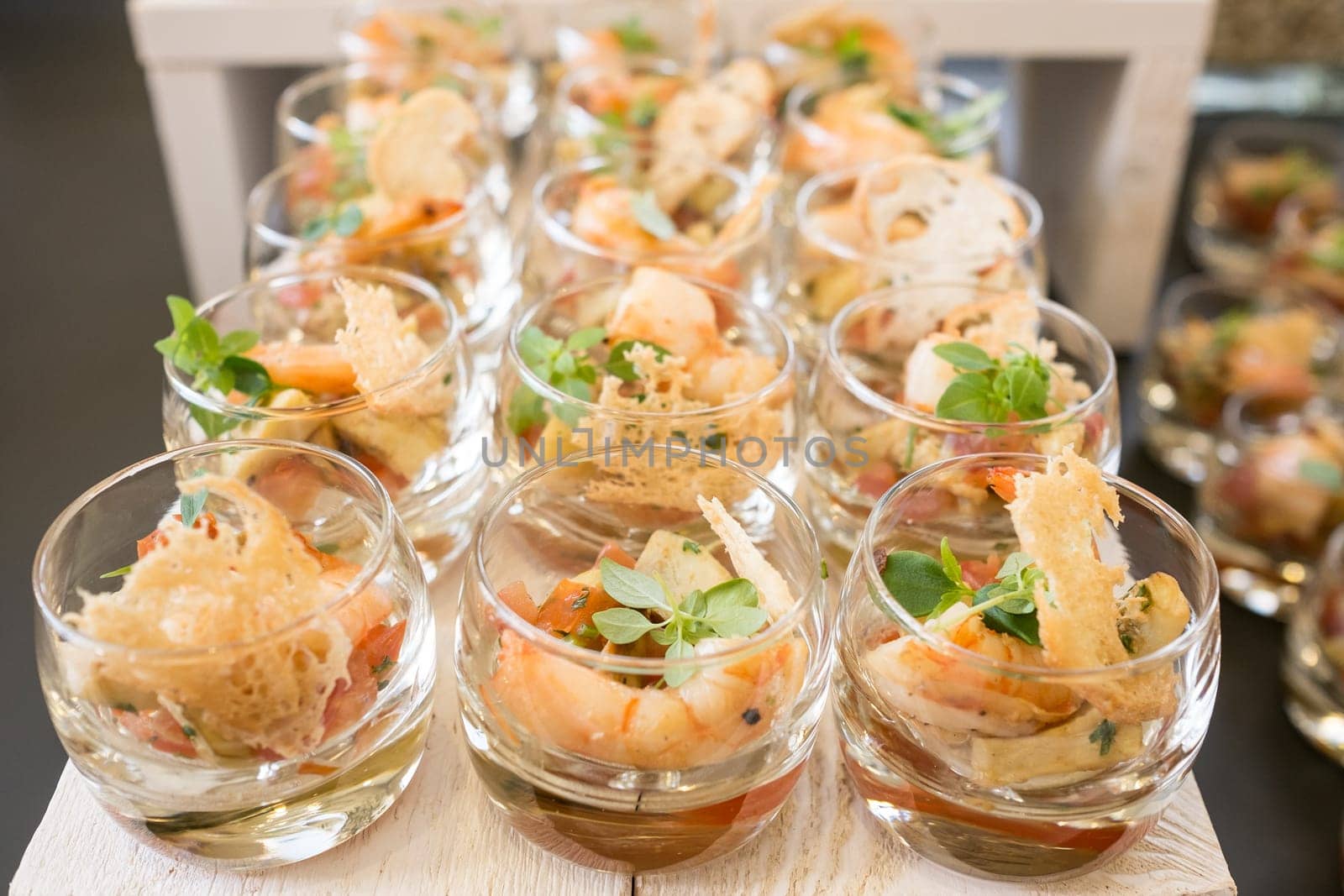 Appetizer in jars with shrimp and basil