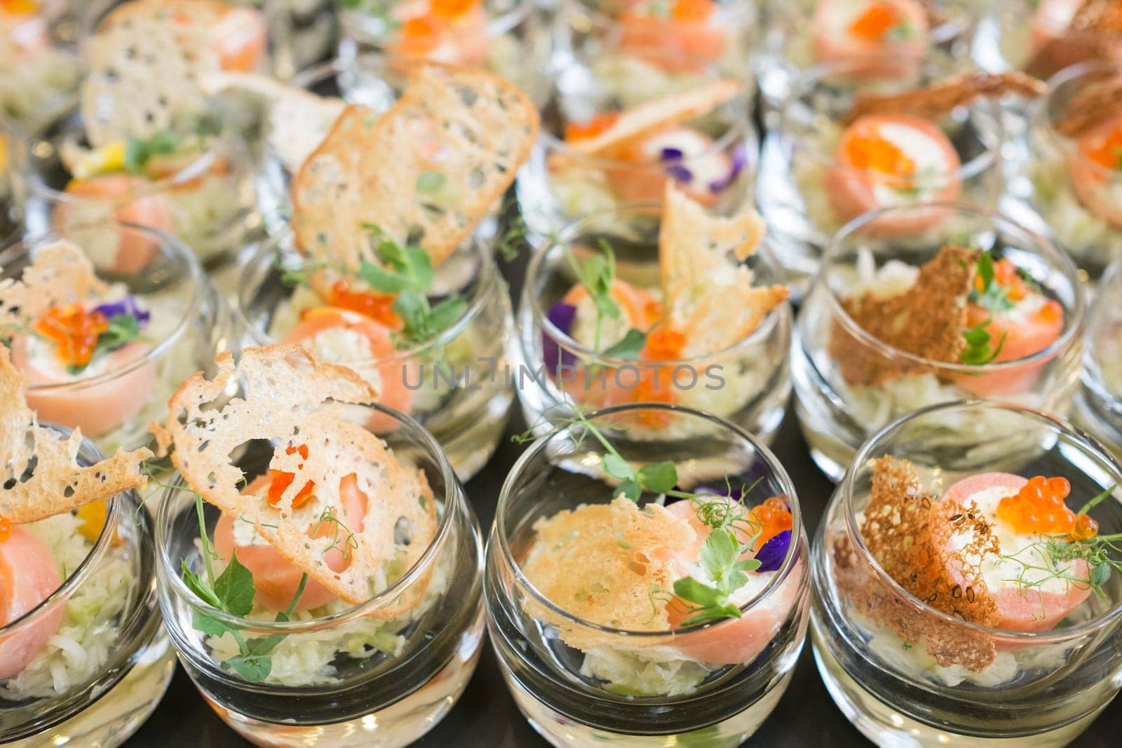 Glasses of salmon cream cheese and caviar
