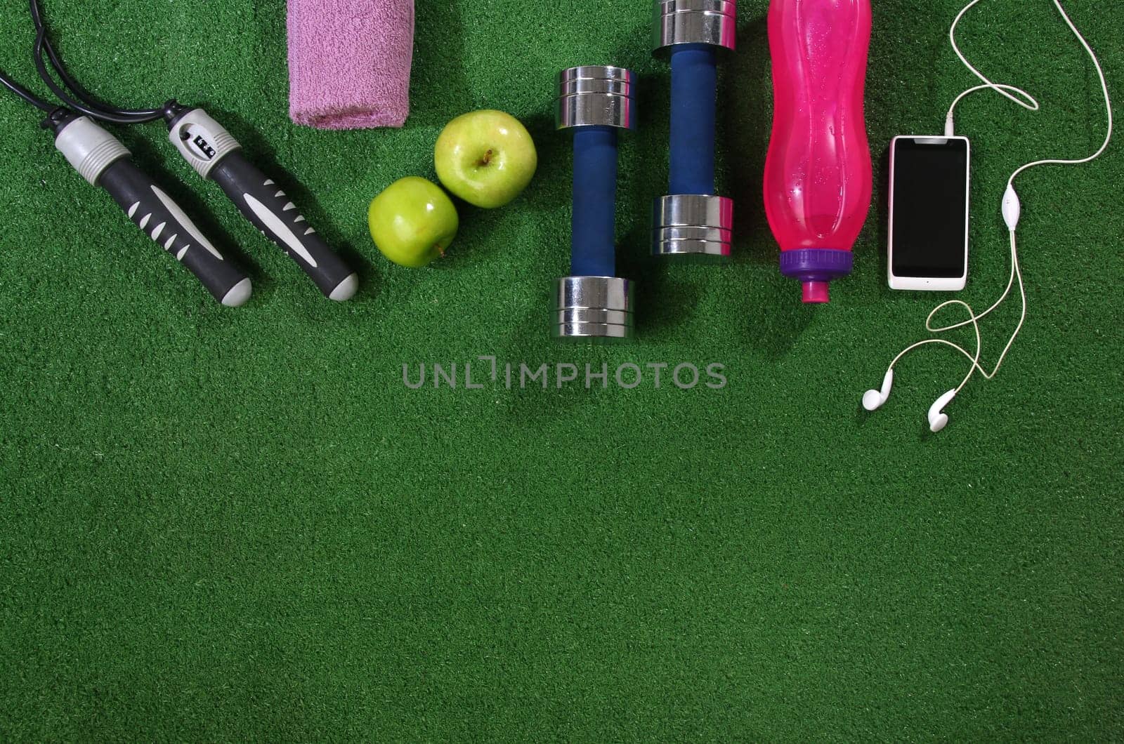 Fitness concept. Various elements over a grass background