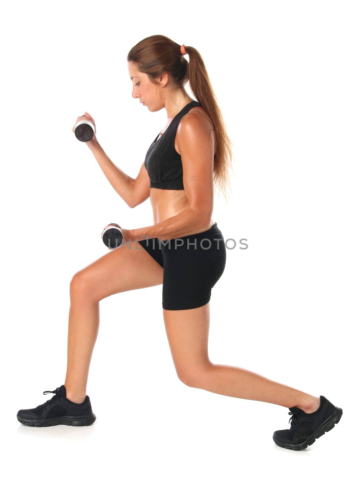 Young woman exercising with dumbbells isolated on white background