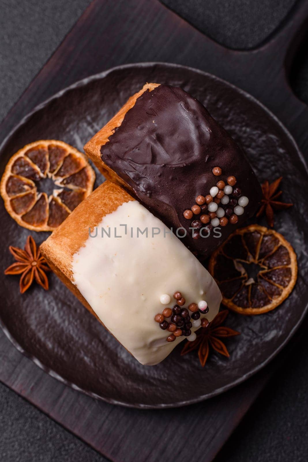 Round sweet New York roll croissant with chocolate cream filling on a dark concrete background