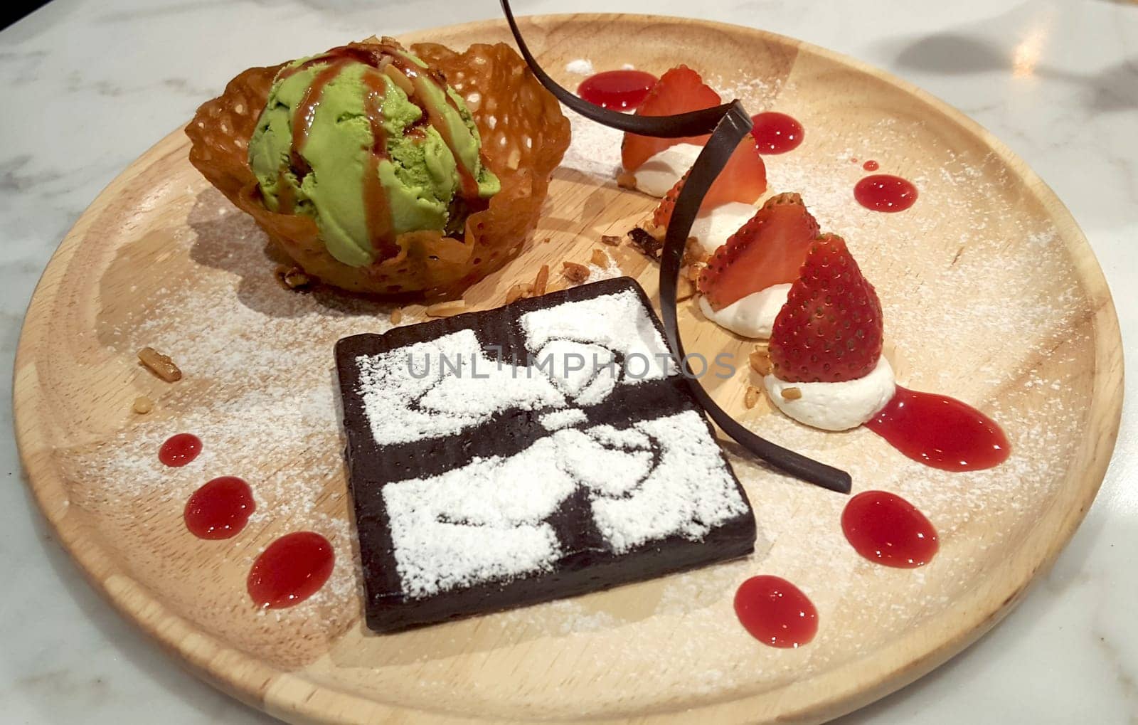 Brownies with Green tea Ice-cream and strawberry in thailand