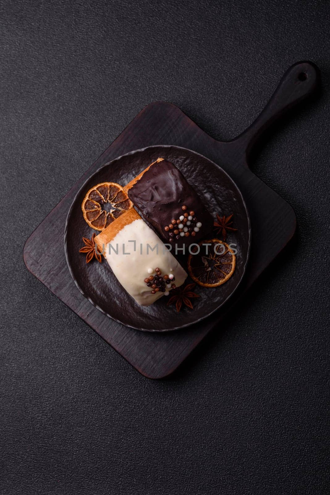 Round sweet New York roll croissant with chocolate cream filling on a dark concrete background