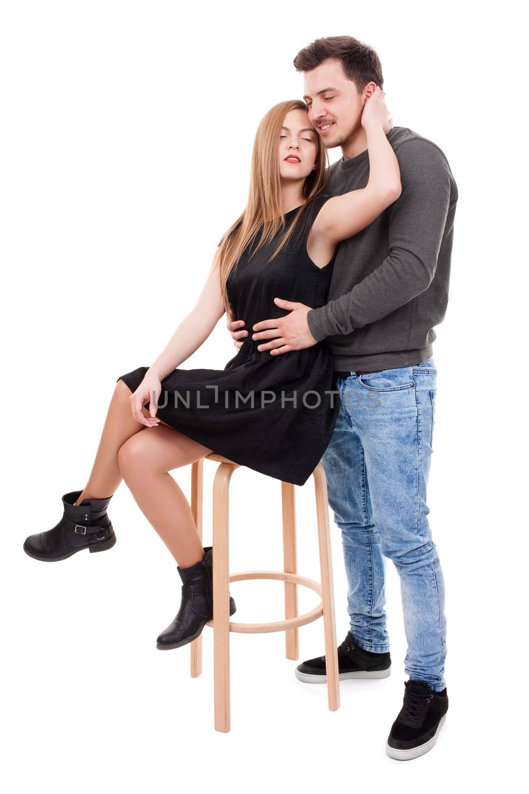 Young couple hugging in intimacy way on white background